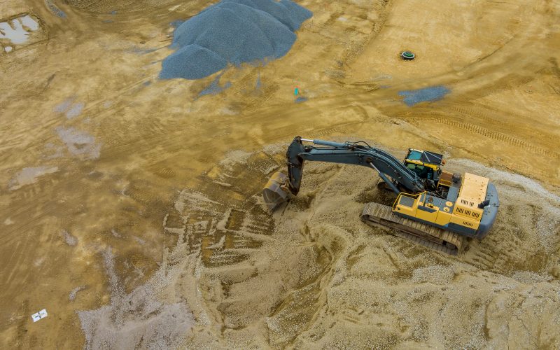 The work with under construction on excavators equipment in the production of earthworks